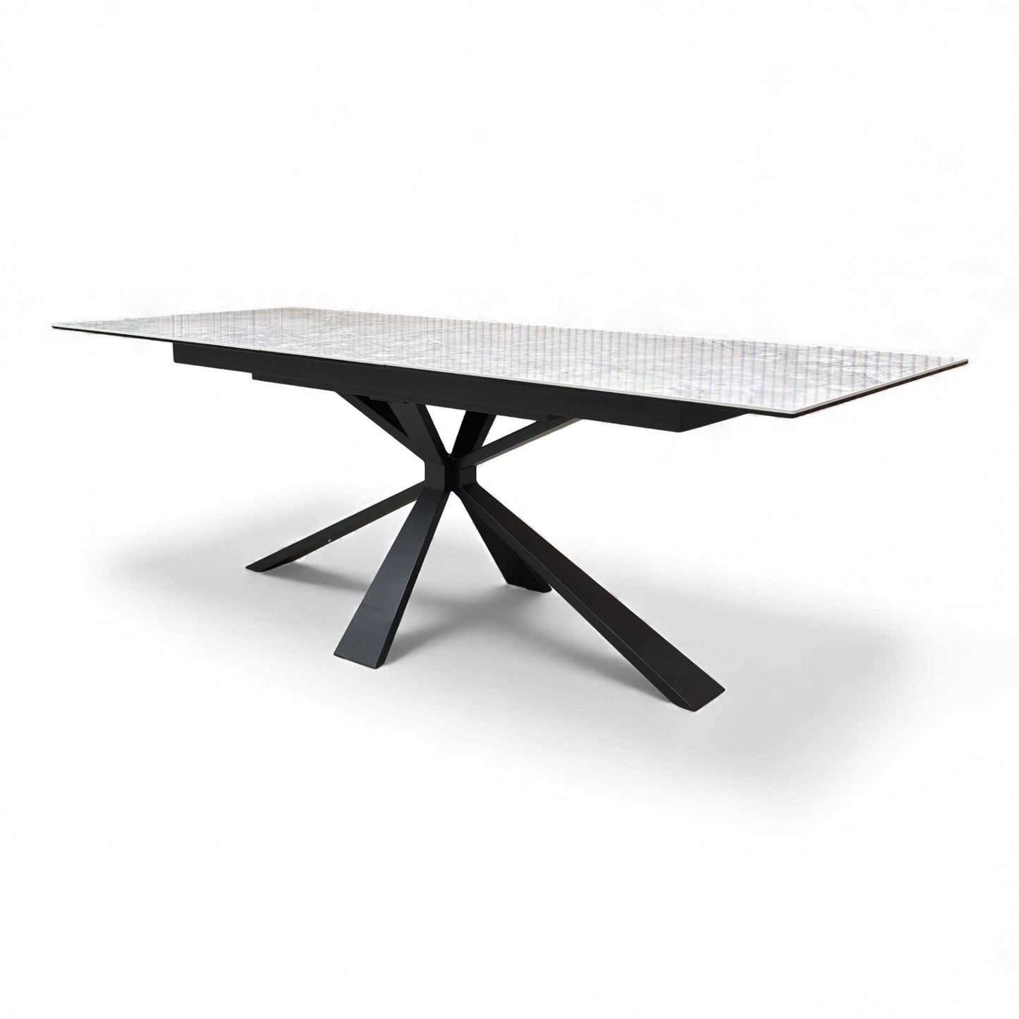 Angled view of the Crete White Ceramic High-Gloss Extending Dining Table with black metal base.