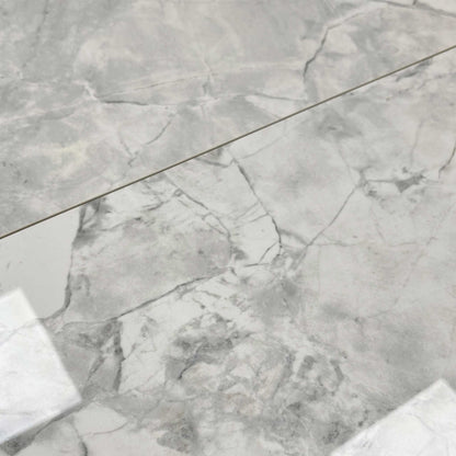 Close-up of the high-gloss white ceramic table top.