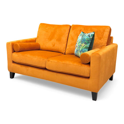 Side view of the Bailey Primo 2 Seater Sofa upholstered in rich Marigold Velvet, showing the side bolster cushions.