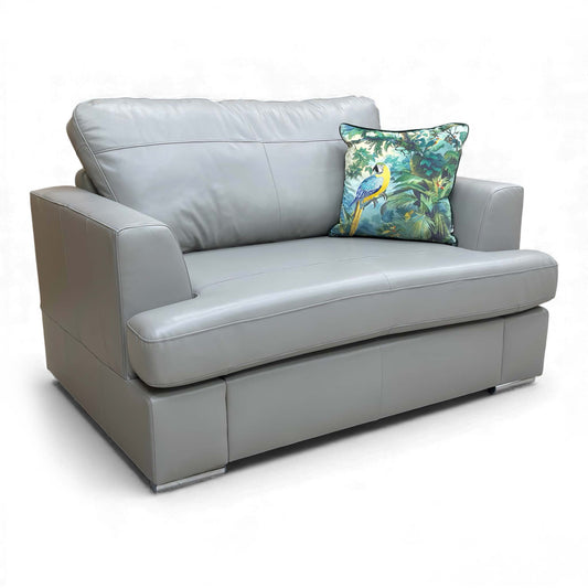 Angled view of the Freya Cuddler Chair upholstered in Dove Grey Beau Leather.