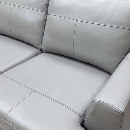 Close-up of the Dove Grey Beau Leather upholstery with embossed grain.