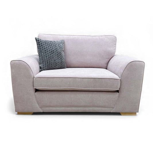 Full front view of the Orka Cuddler Chair, showcasing the supportive foam seat cushions.