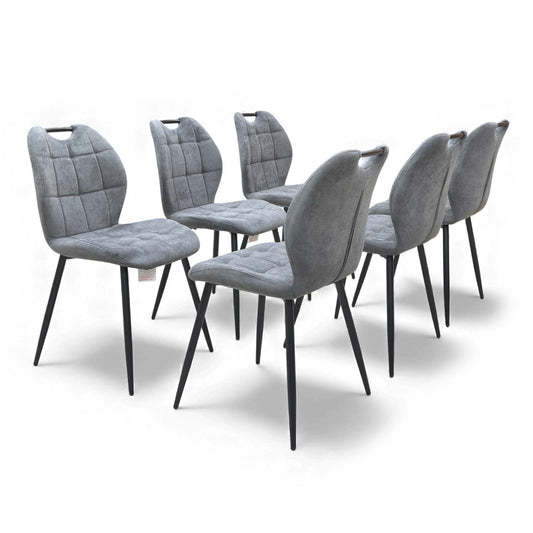 Angled view of the Alva Charcoal Grey Fabric Fixed Dining Chair, showcasing the padded seat.