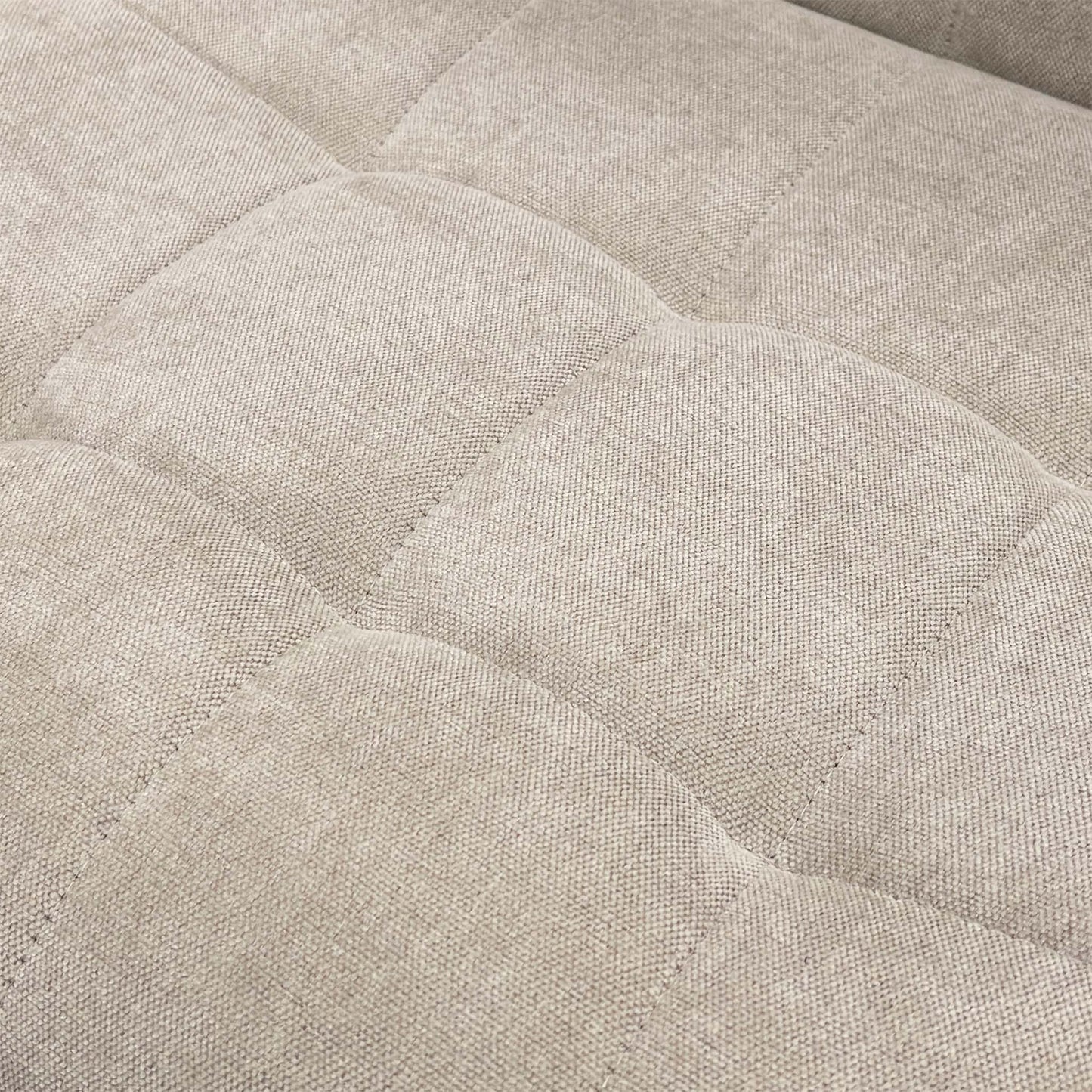 Close-up of the Beige Fabric upholstery texture.