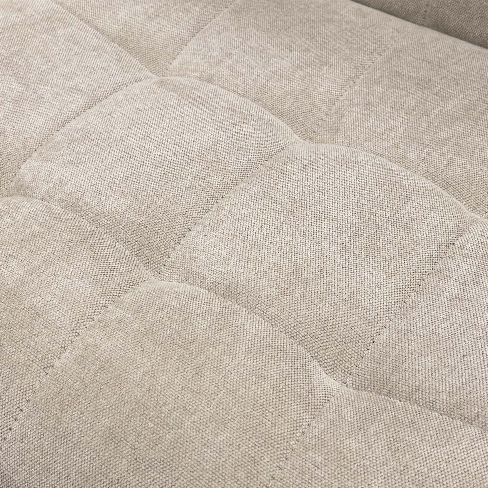Close-up of the Beige Fabric upholstery texture.