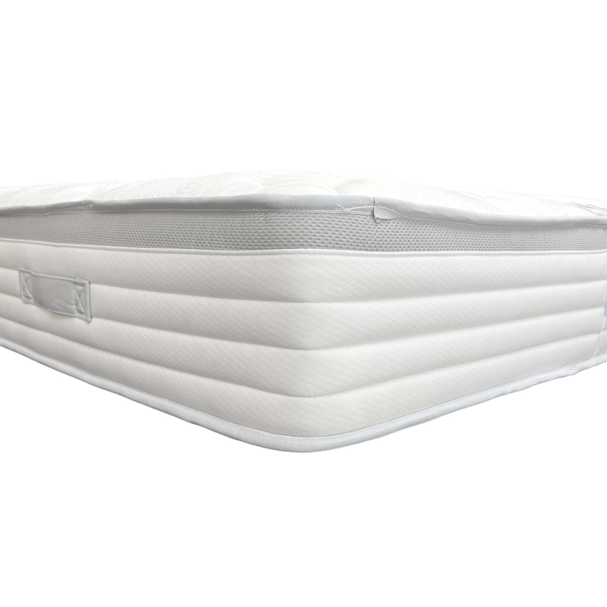 Close-up of the product label on the mattress side, detailing its features and Medium Tension.