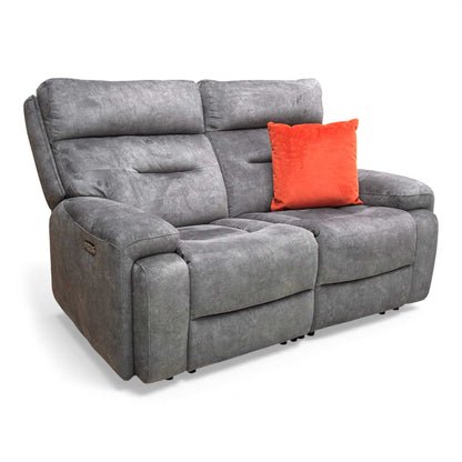 Angled view highlighting the body-hugging design and luxurious, fixed pocket spring seat cushions.