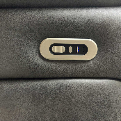 Close-up of the USB charging port and control panel for the electric recliner.