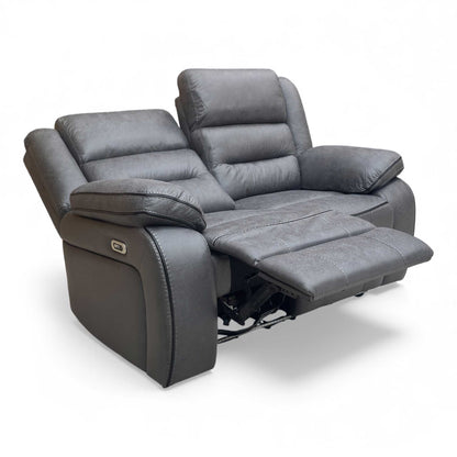Angle View of Thornbrook 'Vegas' Charcoal Grey Microfibre 2-Seater Power Recliner Sofa in a modern living room setting.