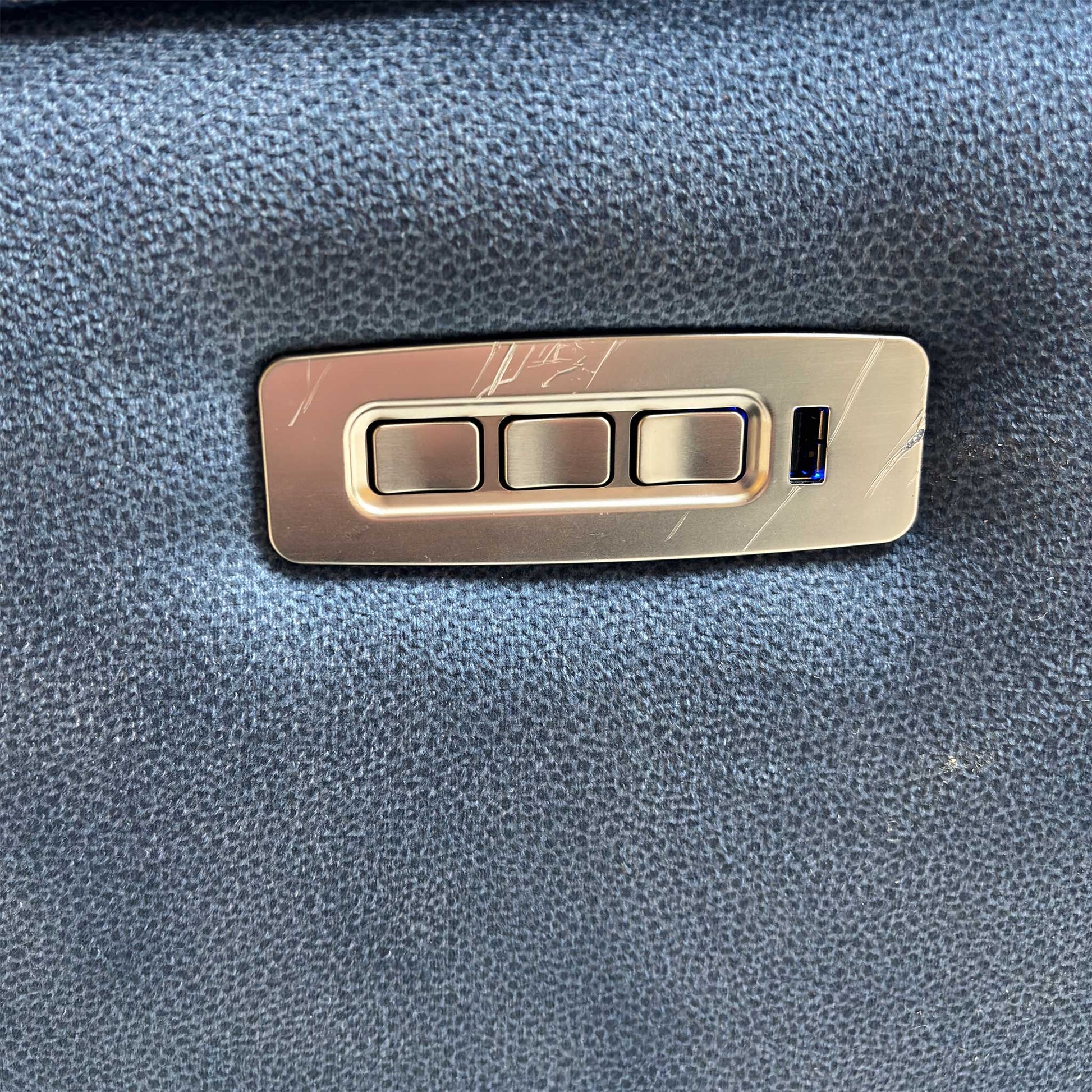 Detail shot of the power control buttons and integrated USB port.