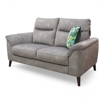 Angled view showcasing the streamlined shape and comfortable cushioned arms of the Dexter 2 Seater Sofa.