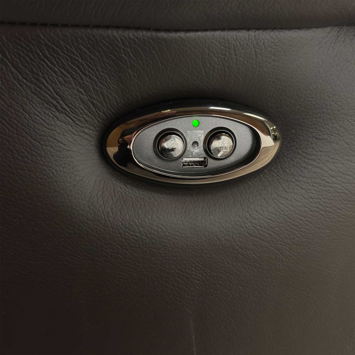Detailed shot of the integrated power recline control panel and built-in USB charging port.