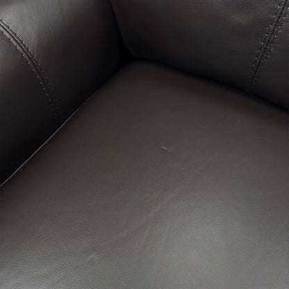Close-up of the supple, high-quality Dark Chocolate Leather upholstery texture and stitching details.