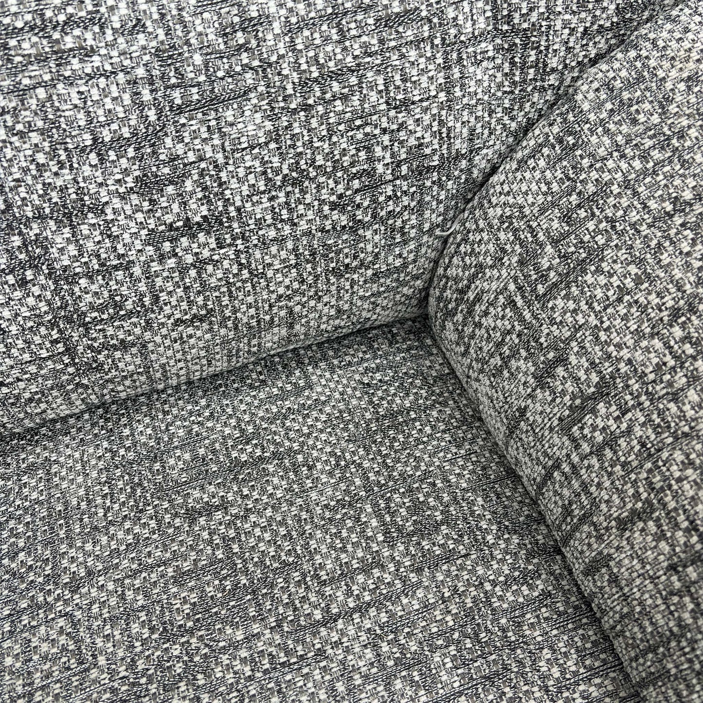 Close-up of the headrest, back cushion, and soft curves of the G Plan Seattle armchair.