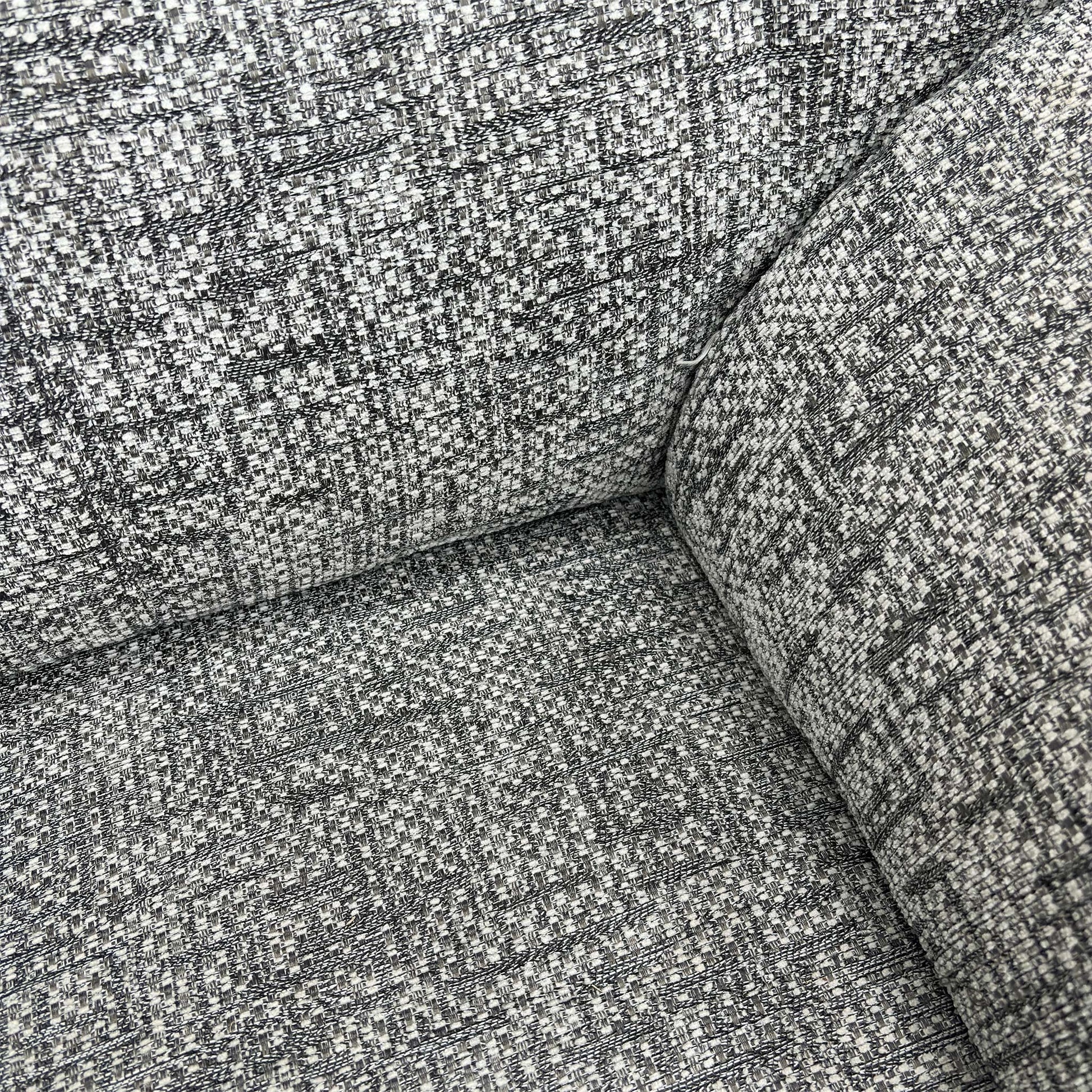 Close-up of the headrest, back cushion, and soft curves of the G Plan Seattle armchair.