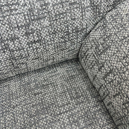 Close-up of the headrest, back cushion, and soft curves of the G Plan Seattle armchair.