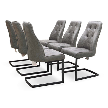 Angled view of the ‘Merlin’ chair, emphasizing the sleek, continuous black powder-coated metal cantilever base and contoured seat shape.