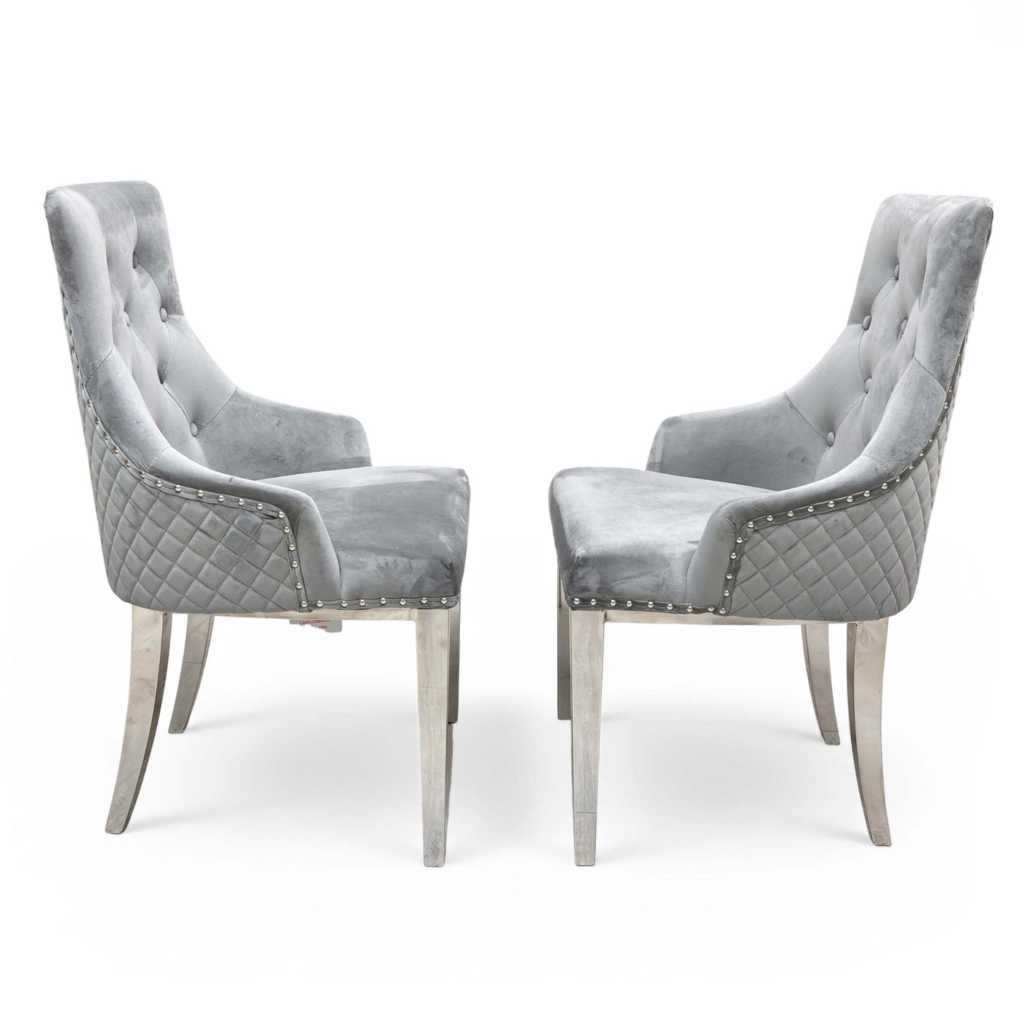 Detail shot of the comfortable upholstered seat, solid wood frame, and sleek metal front legs.