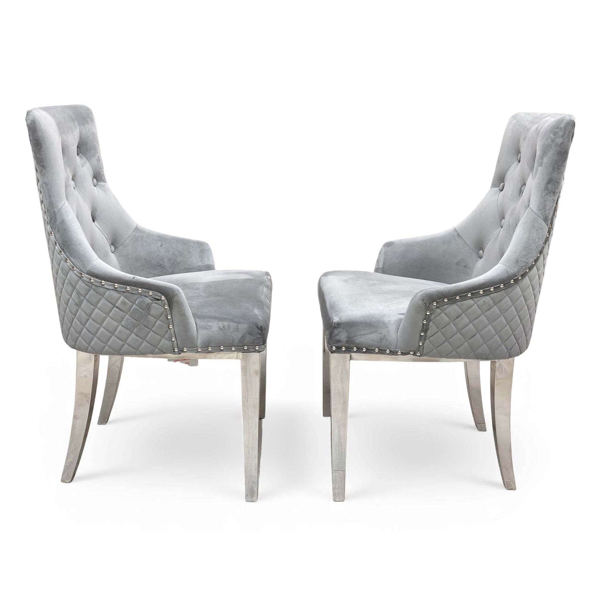 Detail shot of the comfortable upholstered seat, solid wood frame, and sleek metal front legs.