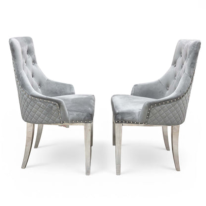 Detail shot of the comfortable upholstered seat, solid wood frame, and sleek metal front legs.