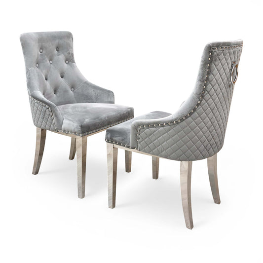 Two Silver Velvet 'Dolce' Dining Chairs shown together in a room setting.