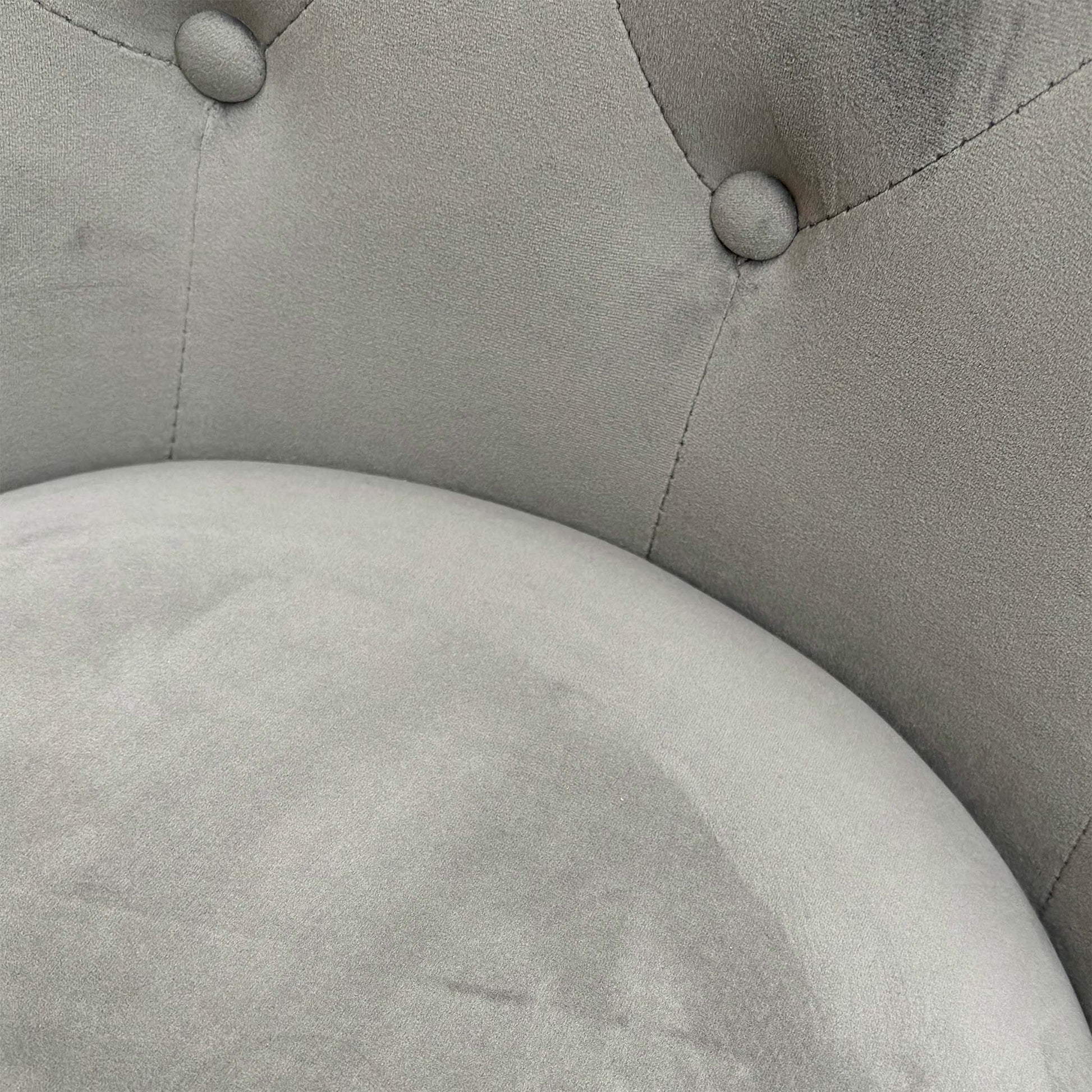 Close-up on the backrest of the 'Dolce' chair, highlighting the metal knocker handle and decorative silver studs.