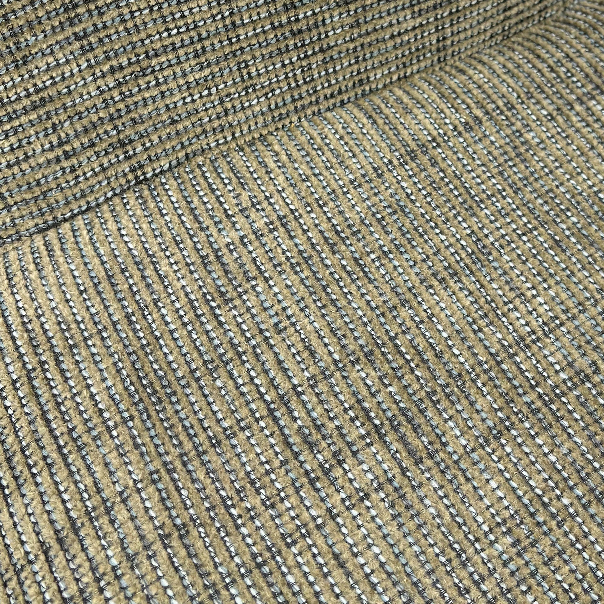 Close-up of the Sage Green Tweed fabric texture on the Charlotte chair.
