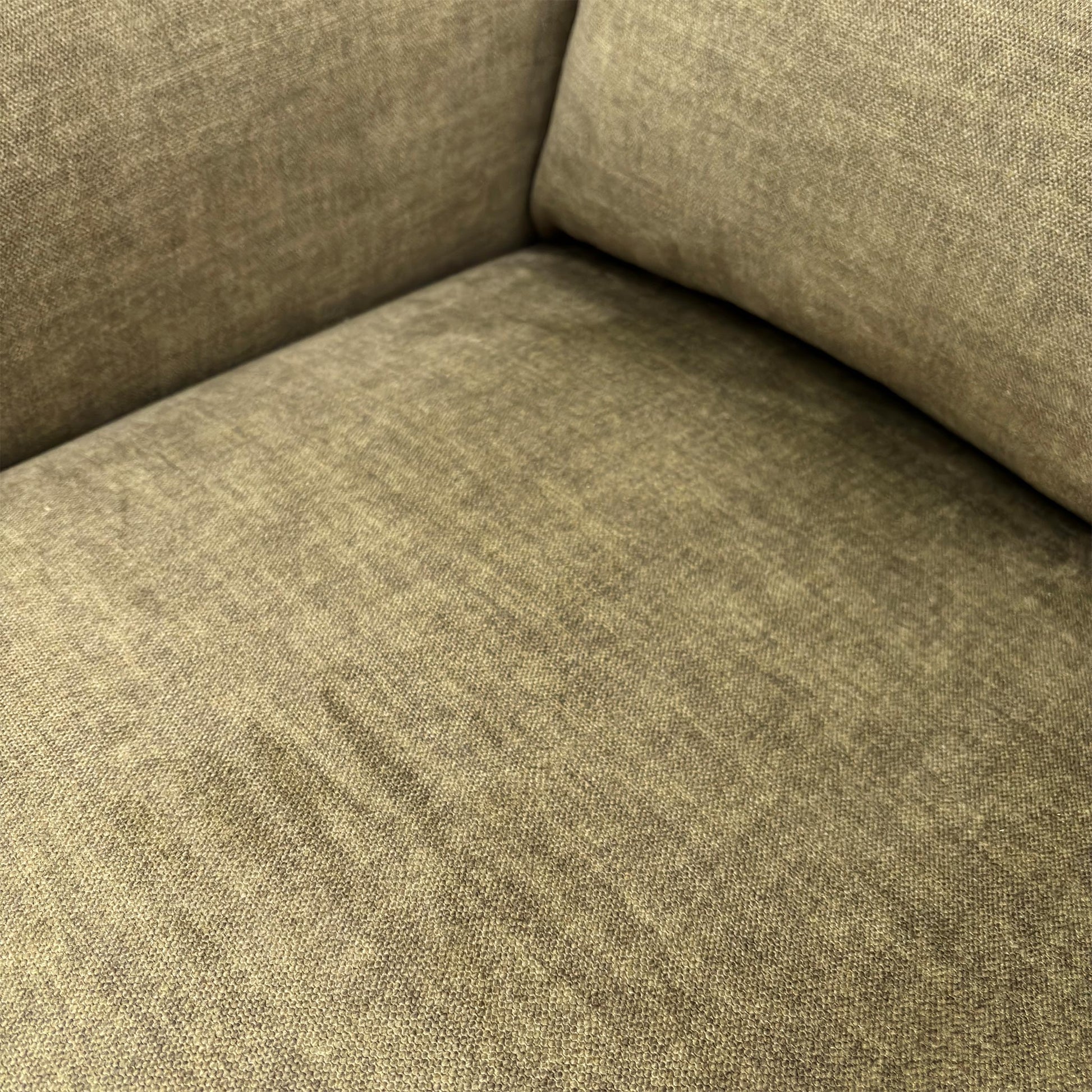 Close-up texture shot of the Vogue Olive Green upholstery fabric.
