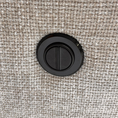 Detail of the electric recliner control buttons located on the side of the armrest.
