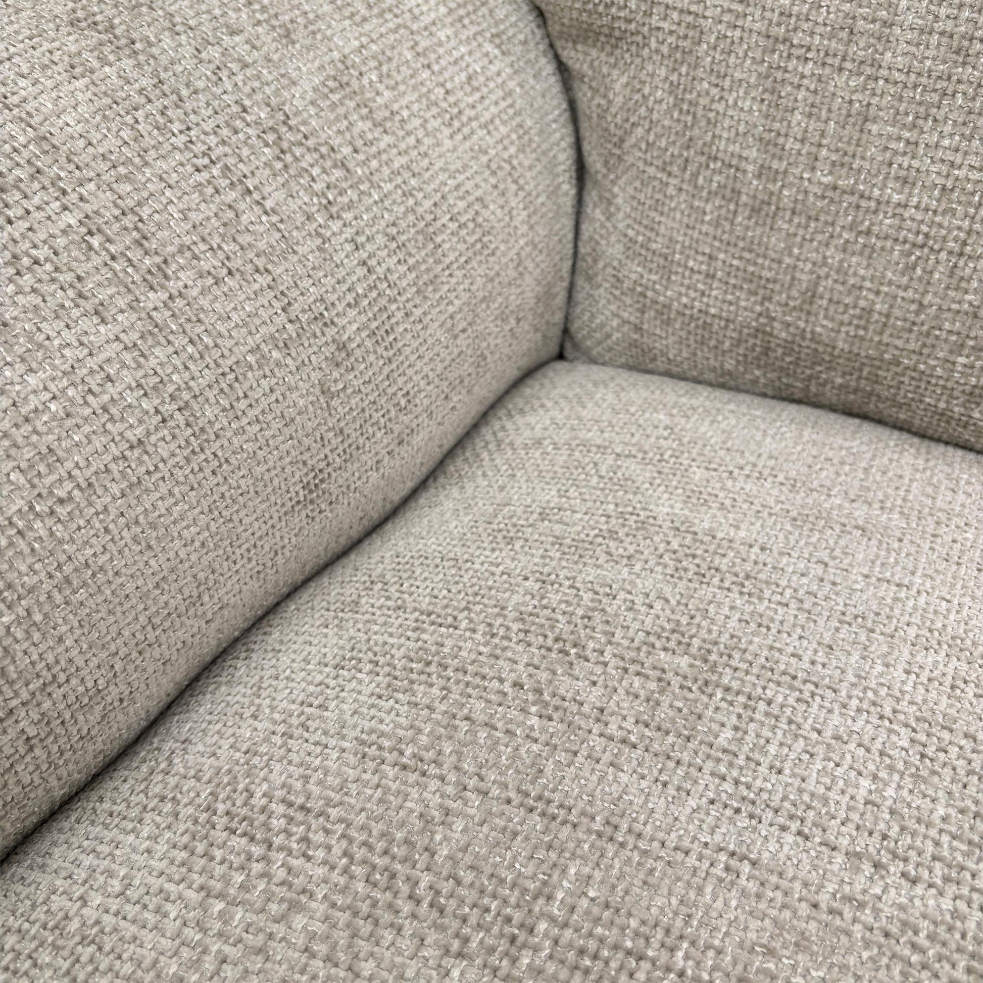 Close-up of the Chunki Pumice Woven Fabric upholstery and stitching detail.