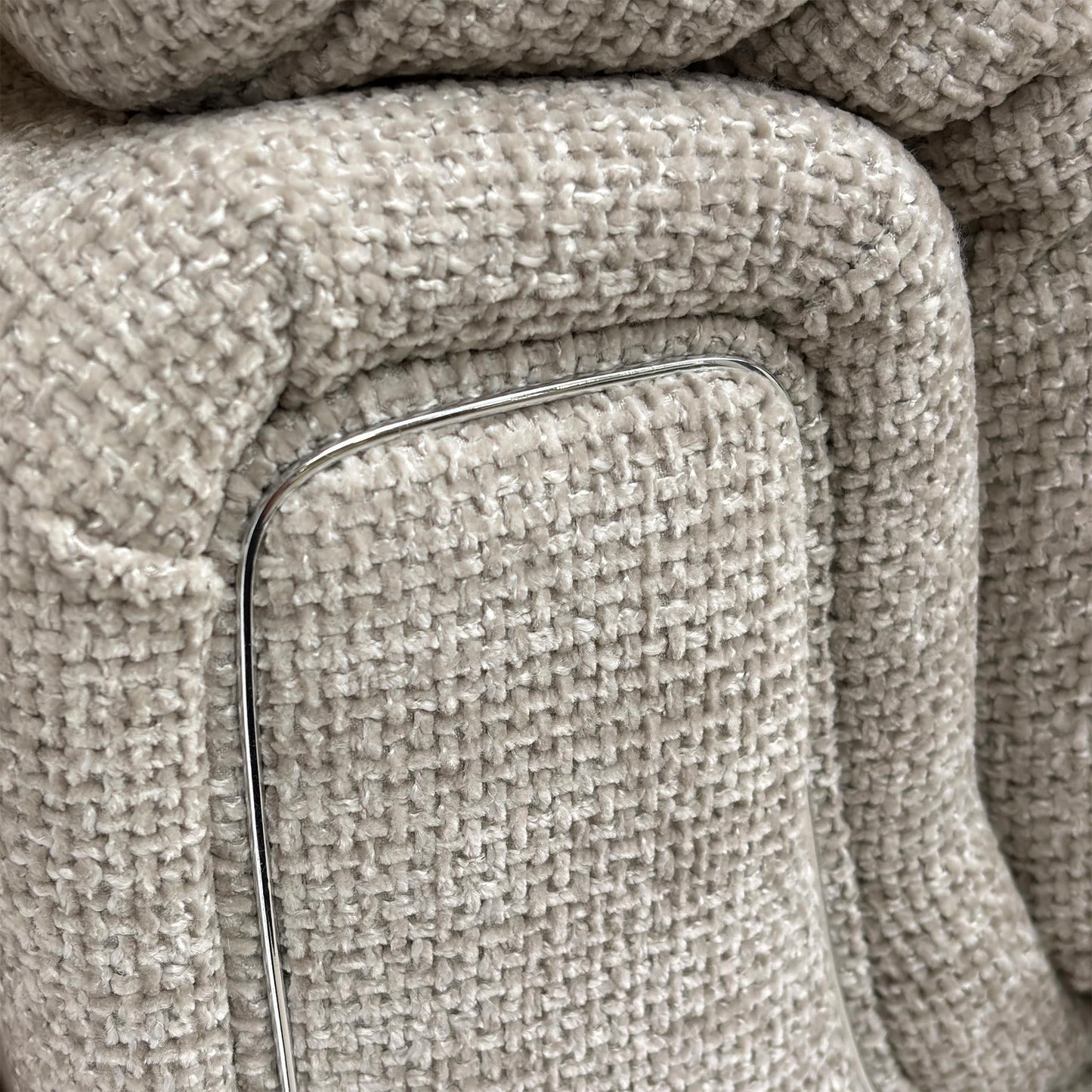 Close-up of the Chunki Pumice Woven Fabric upholstery and stitching detail.