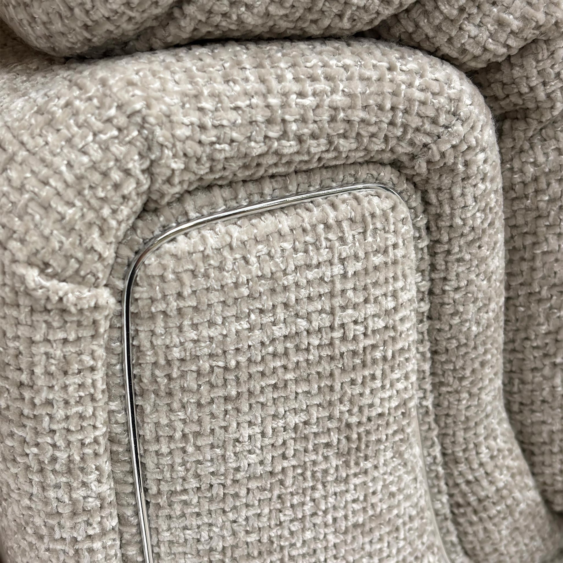 Close-up of the Chunki Pumice Woven Fabric upholstery and stitching detail.