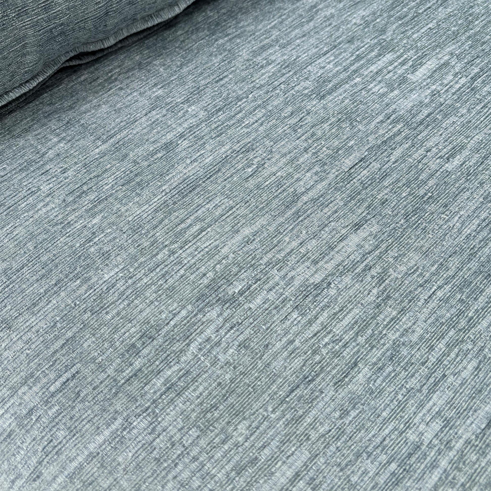 Close-up texture shot of the Eau De Nil fabric upholstery.