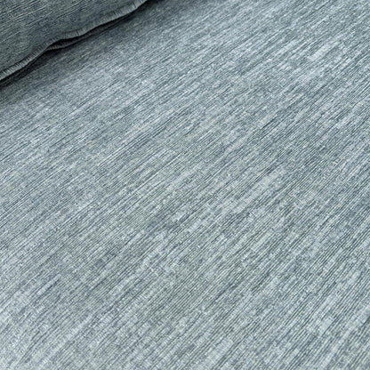 Close-up texture shot of the Eau De Nil fabric upholstery.