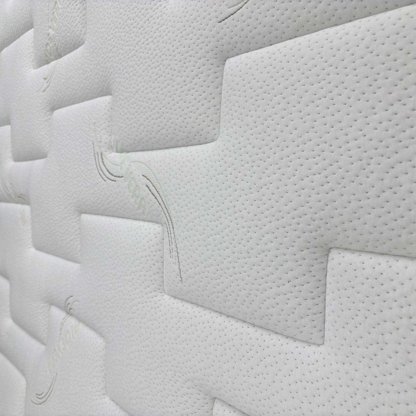 Close-up of the mattress border, showing the stitching and breathable fabric cover.