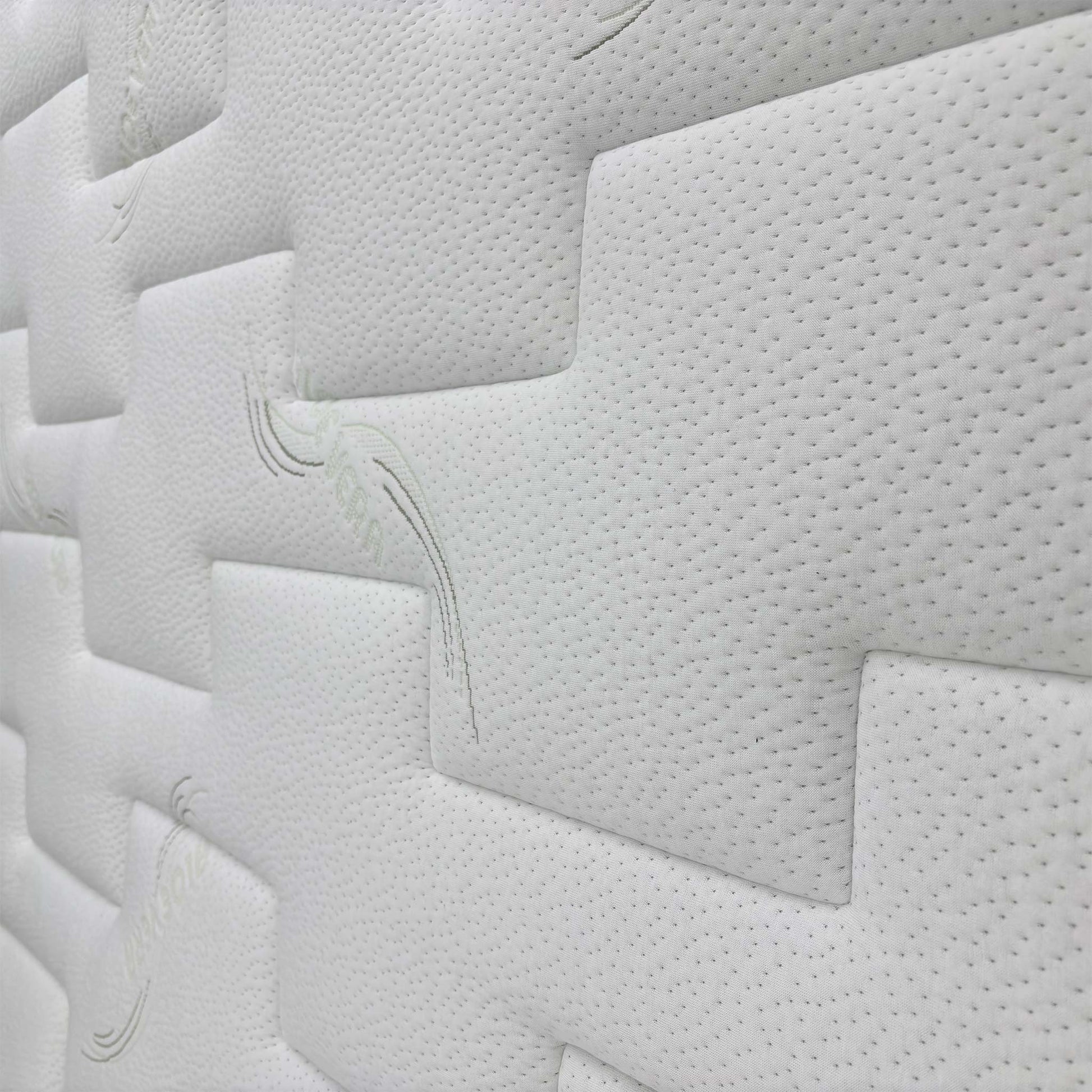 Close-up of the mattress border, showing the stitching and breathable fabric cover.