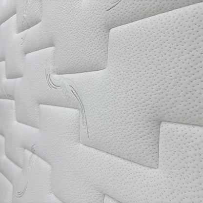 Close-up of the mattress border, showing the stitching and breathable fabric cover.