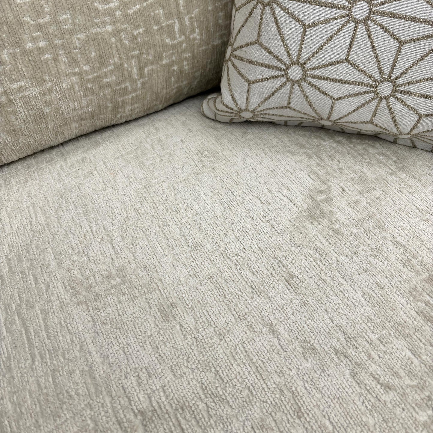 Close-up of the truffle chenille fabric and seat cushion detail.