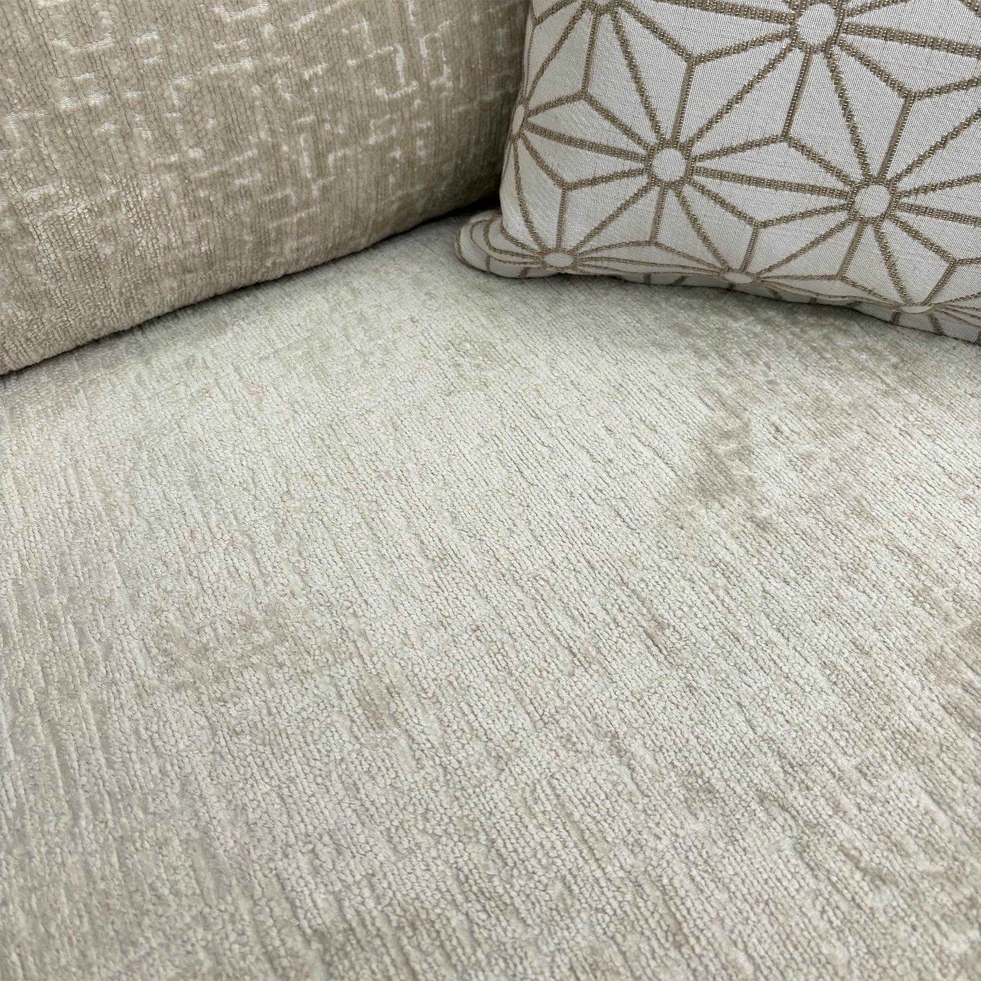Close-up of the truffle chenille fabric and seat cushion detail.