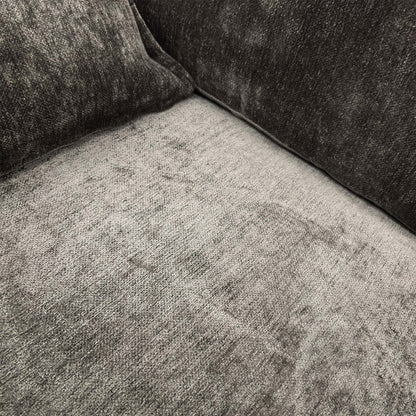 Close-up of the brown chenille fabric and seat cushion detail.