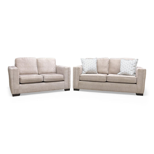 Frontal view of the 'Chelsea' 3 Seater Sofa and 2 Seater Sofa in beige velvet with formal backs.