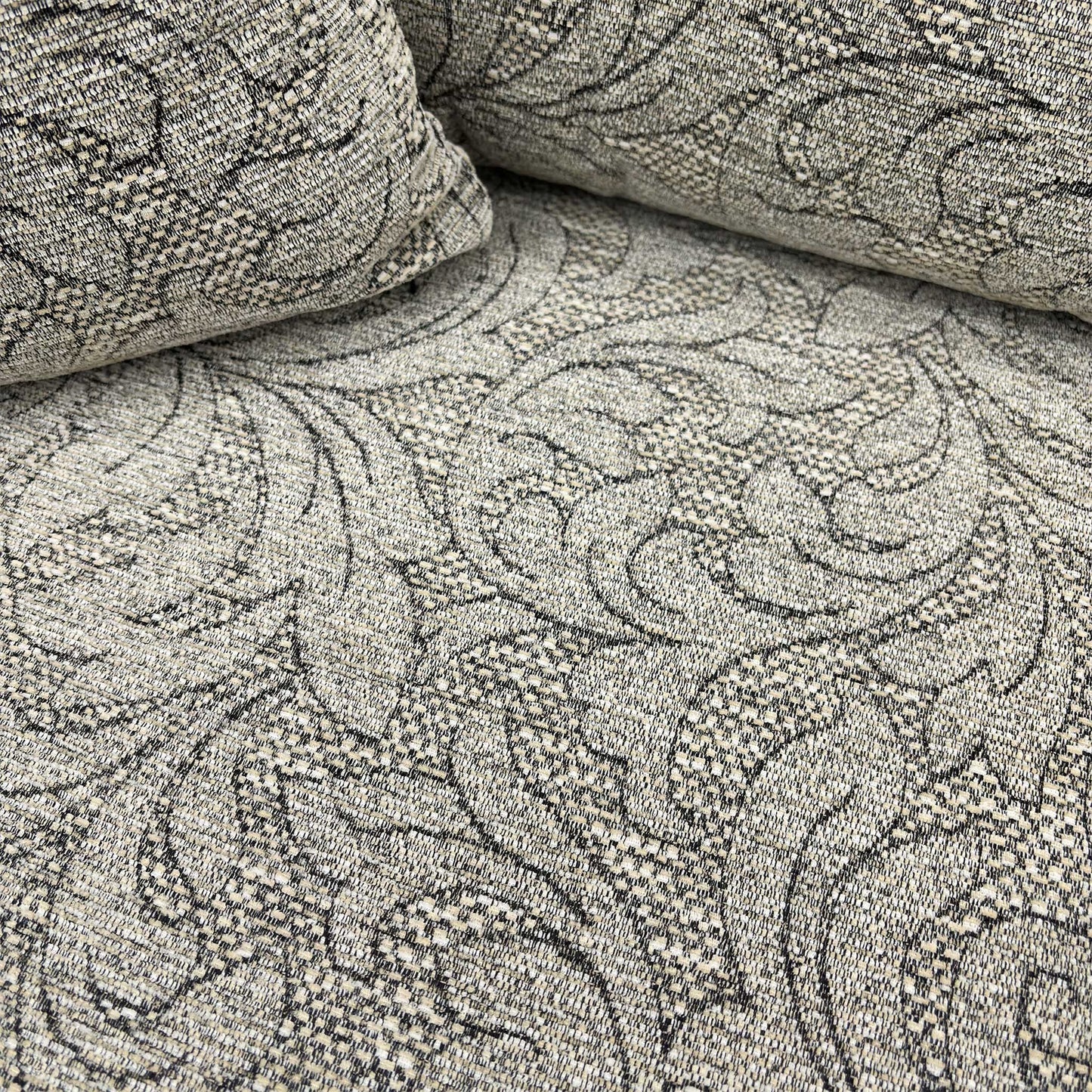 Close-up of the oatmeal patterned woven fabric texture.