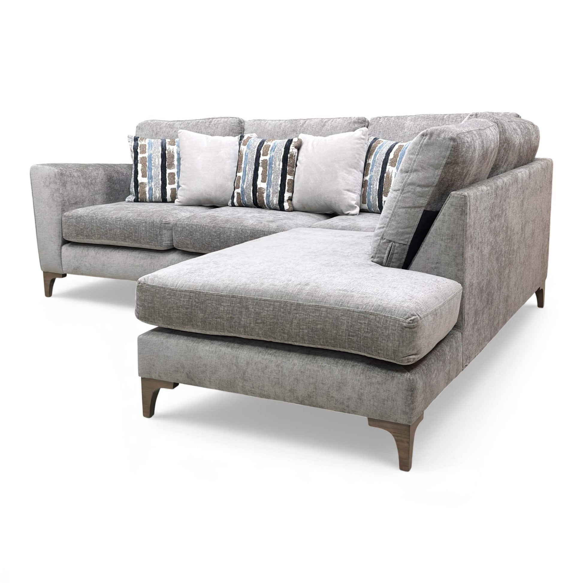 View of the sofa showing the high armrest and formal back cushions.