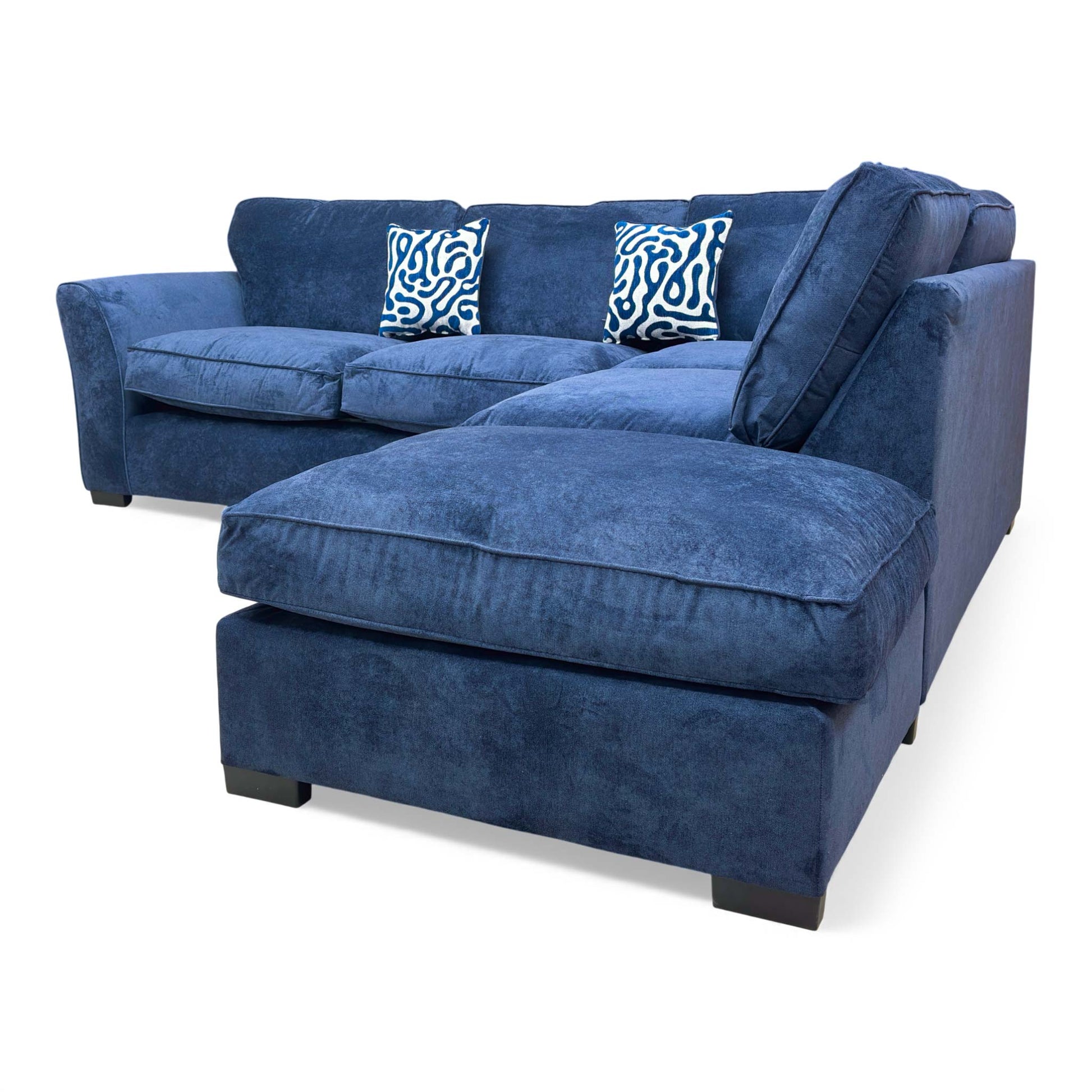 Side view of the ‘Rosie’ Kingston Navy Blue Chaise Corner Sofa, highlighting the sloped arm and modern design.