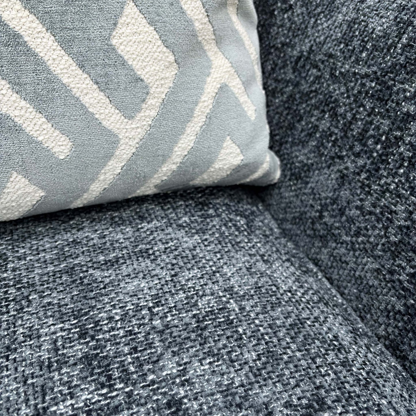 Close-up of the Navy Blue Woven Fabric and walnut-finished wood feet on the ‘Tabitha’ Chair.