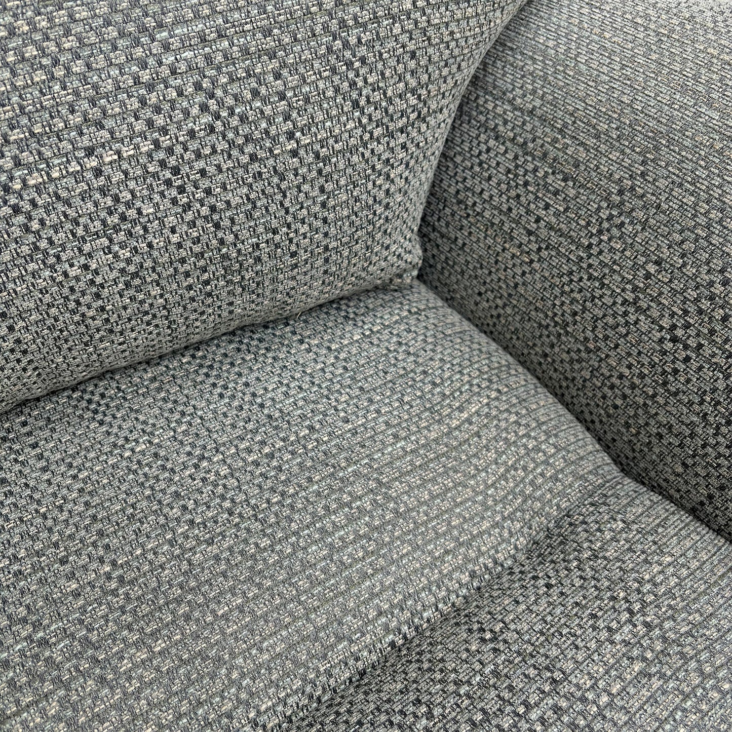 Close-up of the premium duck egg woven fabric upholstery.