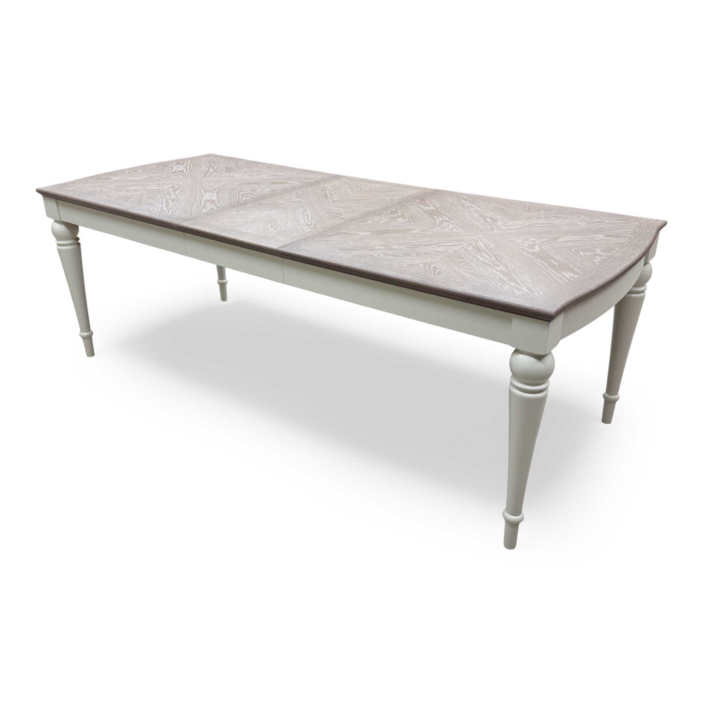 View of the table with the extension leaf exposed or partially showing the mechanism.