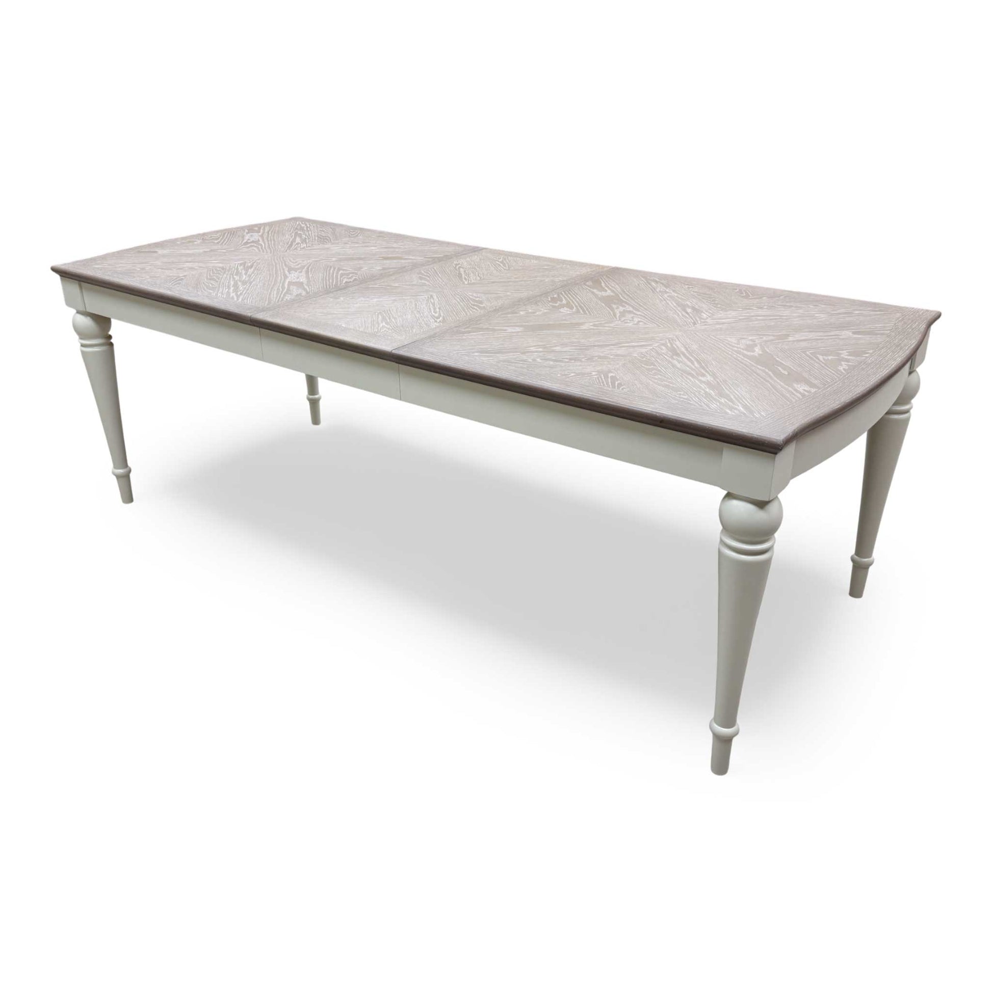 View of the table with the extension leaf exposed or partially showing the mechanism.