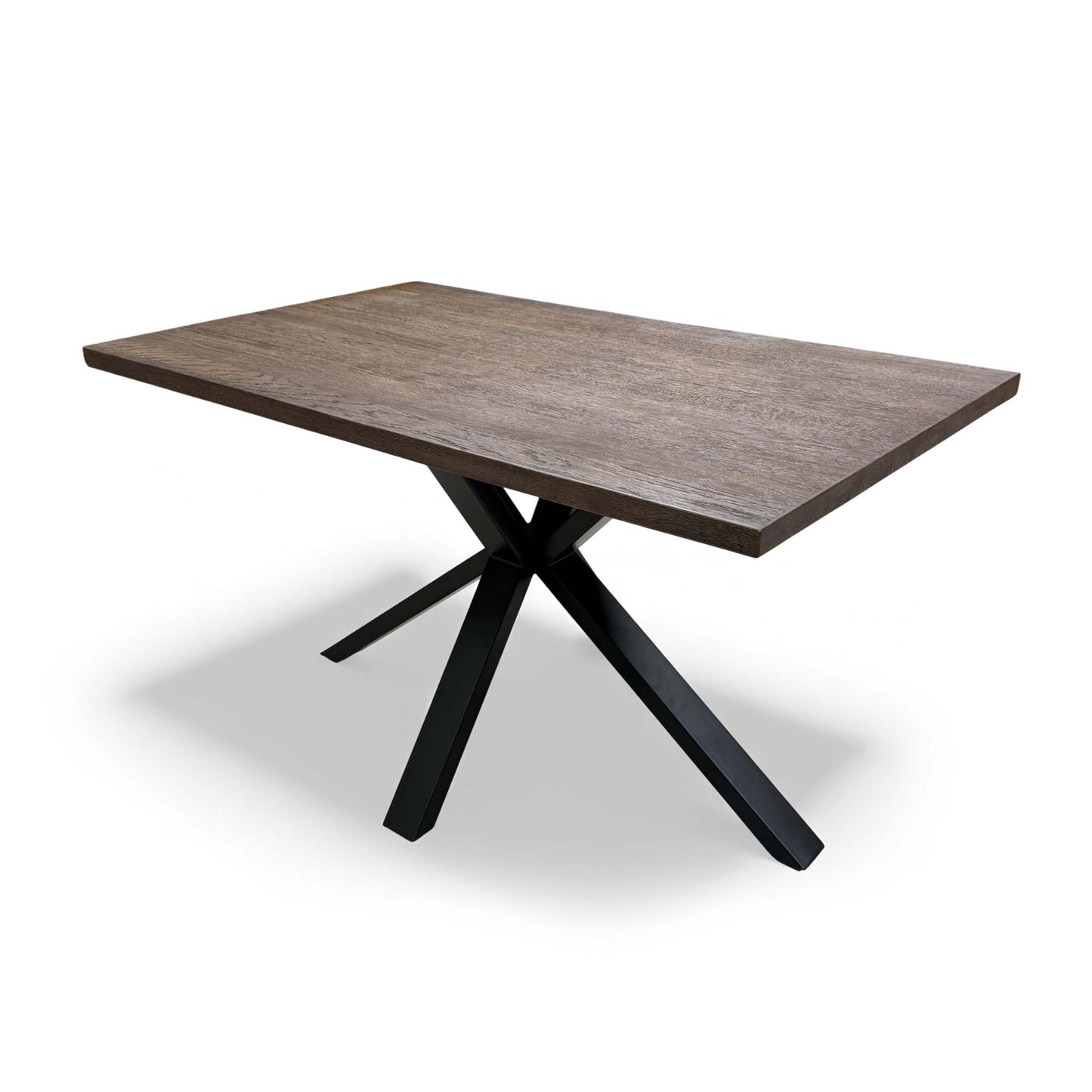 Close-up showing the connection point between the dark oak tabletop and the metal legs.