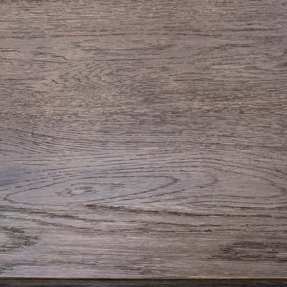 Close-up view of the table's dark metal legs/base.